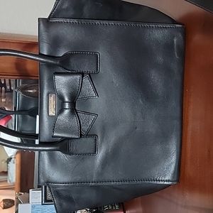 Large Kate Spade purse with crossbody strap.